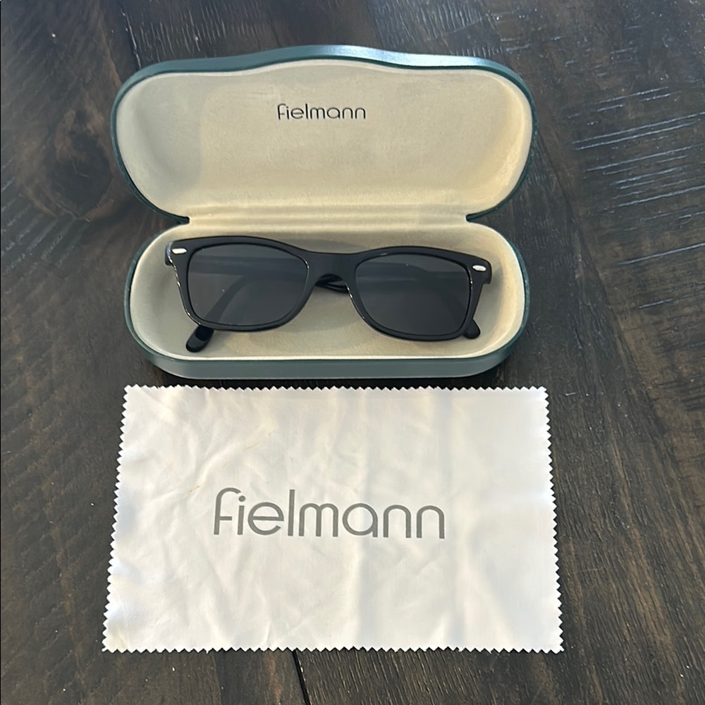 Black sunglasses with sleek design and protective case